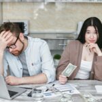 a man and woman doing budgeting
